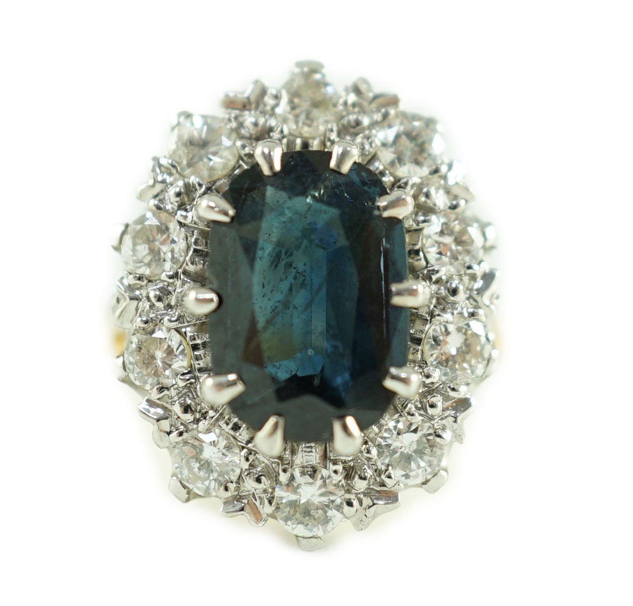 An 18ct gold, sapphire and diamond set oval cluster dress ring